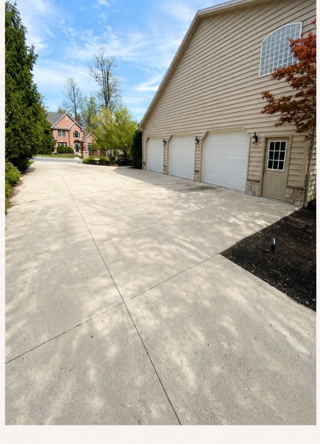 After Fresh Wash pressure washing — bright, clean concrete driveway