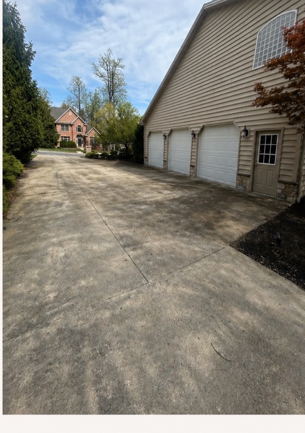 Before Fresh Wash pressure washing — stained, dirty concrete driveway